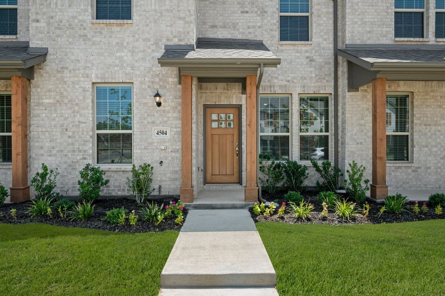 Front exterior of a new home in Sanger Circle – Townhomes, Sanger, TX, highlighting curb appeal (Image 29). Front exterior of a new home in Sanger Circle – Townhomes, Sanger, TX, highlighting curb appeal (Image 29).