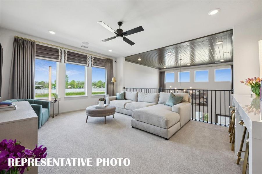 Light filled, spacious game rooms where the entire family can entertain can be found in may of our homes in Painted Tree Woodlands West.  REPRESENTATIVE PHOTO OF MODEL HOME
