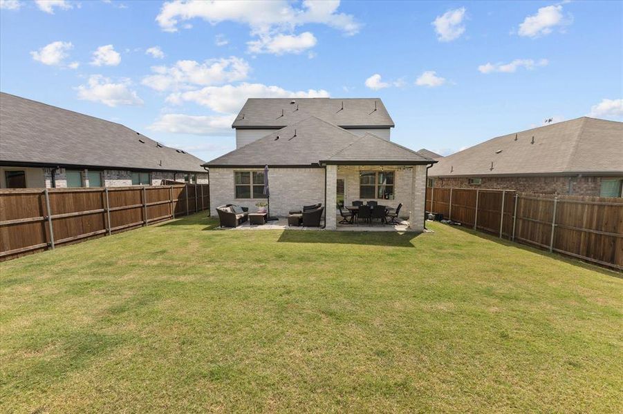 Exterior details and patio area of a home in DeBerry Reserve, Royse City (Image 22). Exterior details and patio area of a home in DeBerry Reserve, Royse City (Image 22).