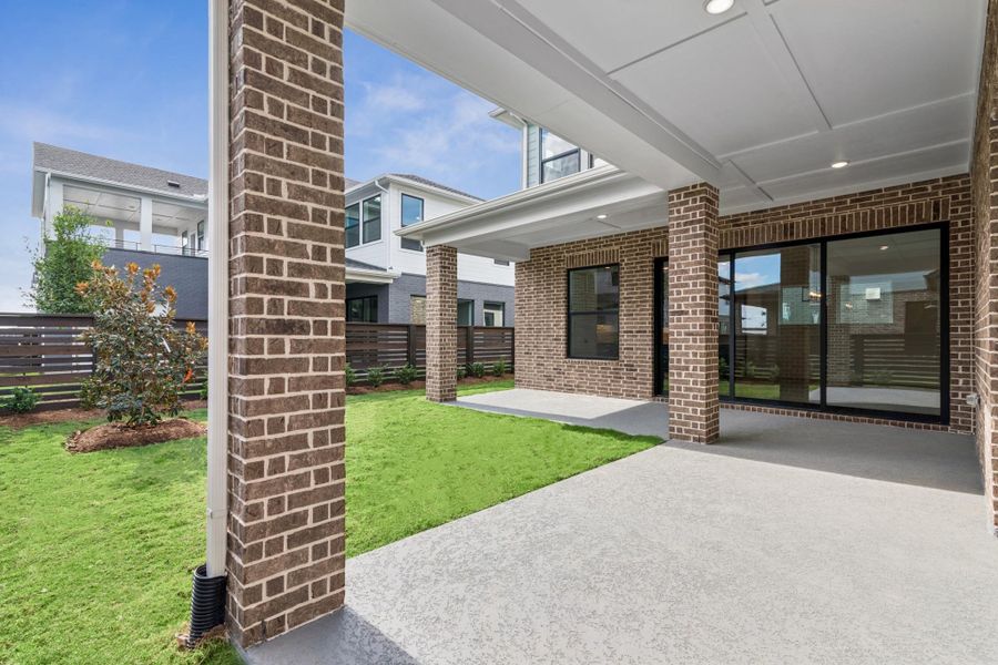 Exterior details and patio area of a home in Easthaven at Bridgeland Central - Vision Collection, Cypress (Image 3).