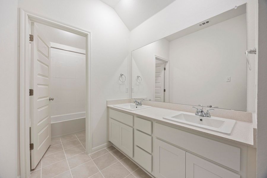 Bathroom in the Magnolia home plan by Trophy Signature Homes – REPRESENTATIVE PHOTO