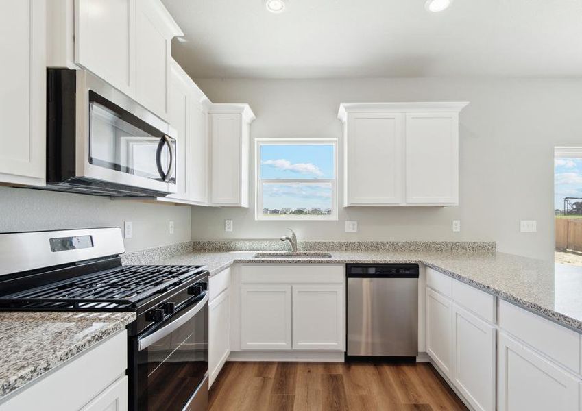 The kitchen of the Laramie has sprawling granite countertops.