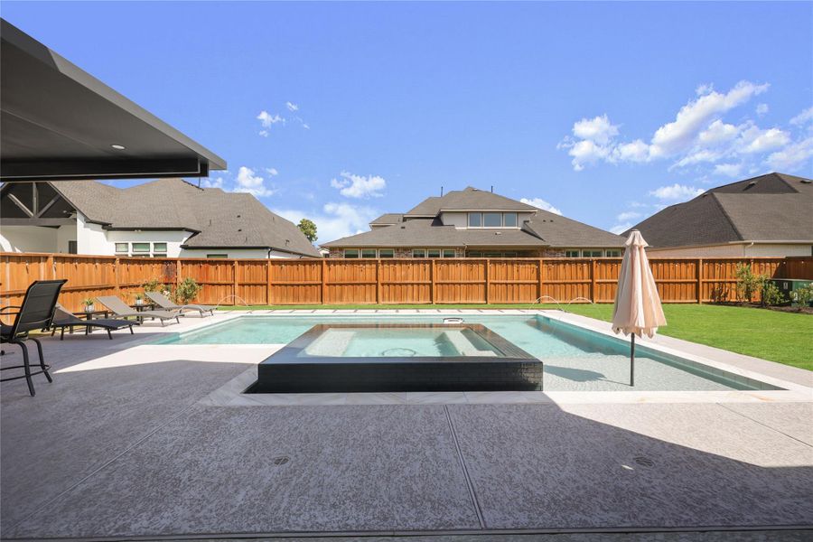 Exterior details and patio area of a home in Woodson’s Reserve, Spring (Image 27).