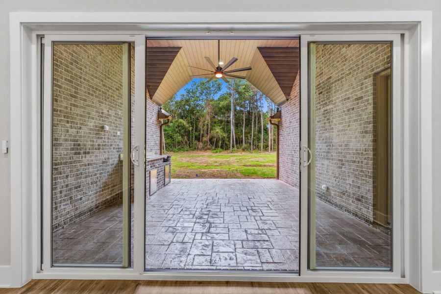 This beautiful three-panel door opens wide, perfect for seamless indoor-outdoor entertaining.