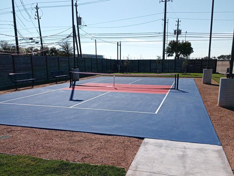 Grab your paddle and join your neighbors for a competitive game of pickleball on the community court.