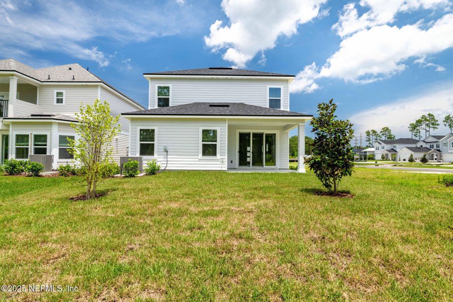 Front exterior of a new home in Beacon Lake, St. Augustine, FL, highlighting curb appeal (Image 32).