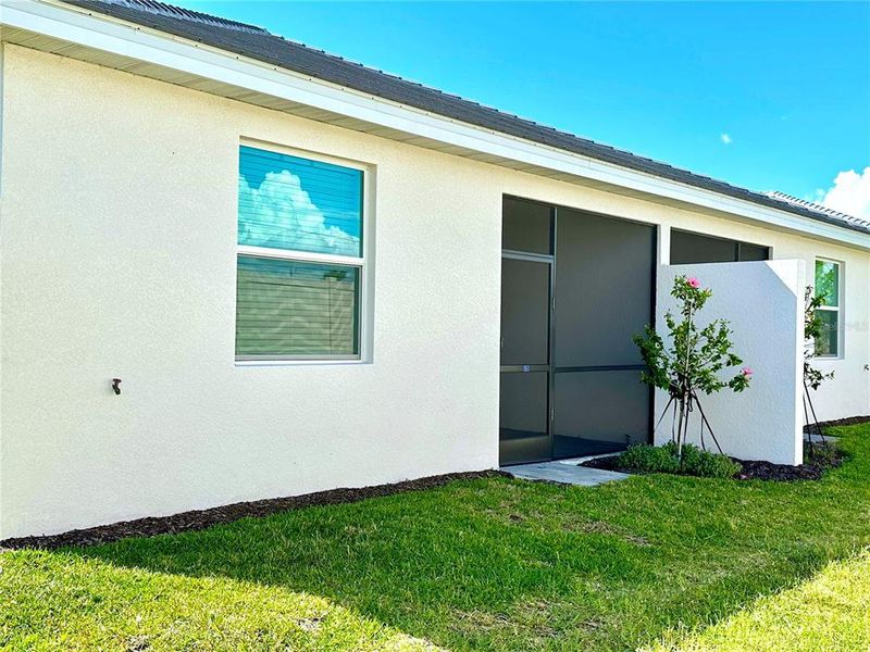 Exterior details and patio area of a home in Palm Lake at Coco Bay, Englewood (Image 3).