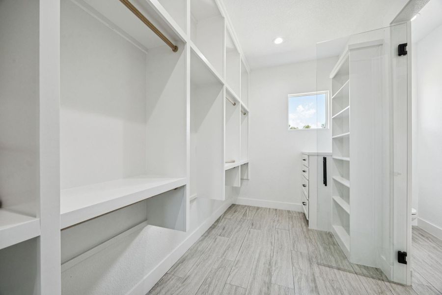 Primary Closet has endless space, with racks along the bottom there is not an inch of the closet that isn't being used! Primary Closet has endless space, with racks along the bottom there is not an inch of the closet that isn't being used!