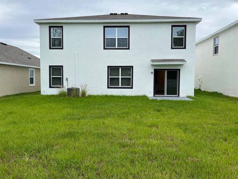 Exterior details and patio area of a home in Epperson, Wesley Chapel (Image 24).