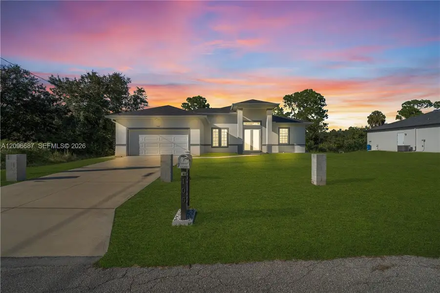Front exterior of a new home in , Lehigh Acres, FL, highlighting curb appeal (Image 20).
