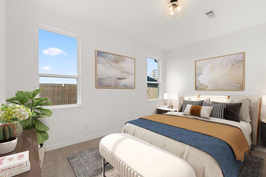 The primary bedroom is generously sized, creating a tranquil and spacious retreat that offers ample room for relaxation. Featuring plush carpet, high ceilings, fresh paint, and large windows that lets in natural lighting throughout the day.