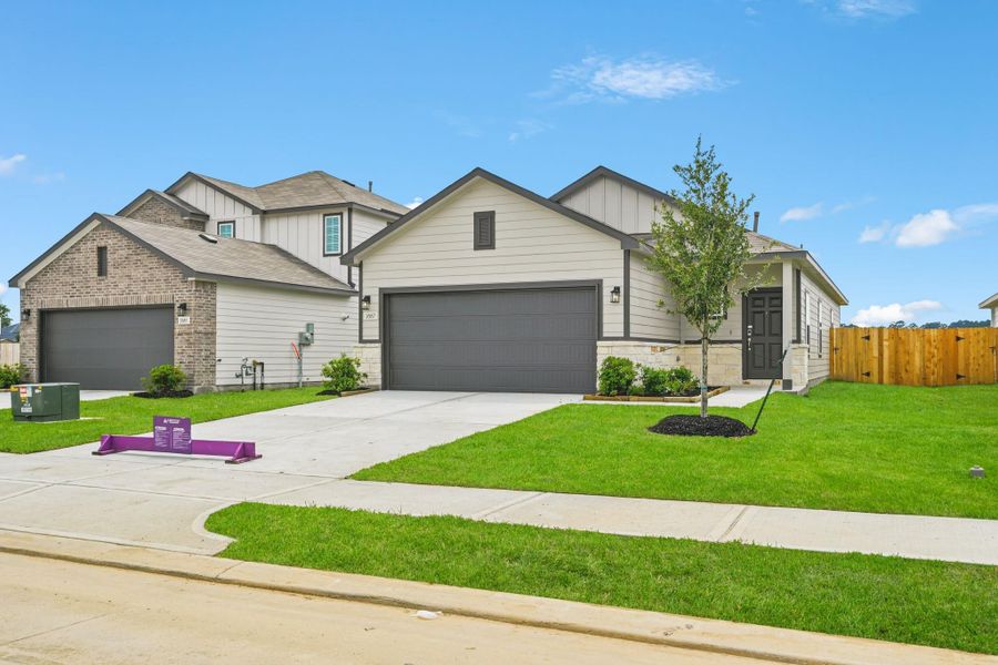 Front exterior of a new home in The Villages at Westpointe, Dayton, TX, highlighting curb appeal (Image 19).