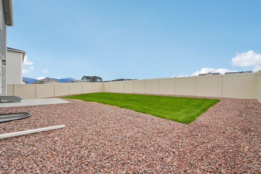 Exterior details and patio area of a home in The Trails at Aspen Ridge, Colorado Springs (Image 28).
