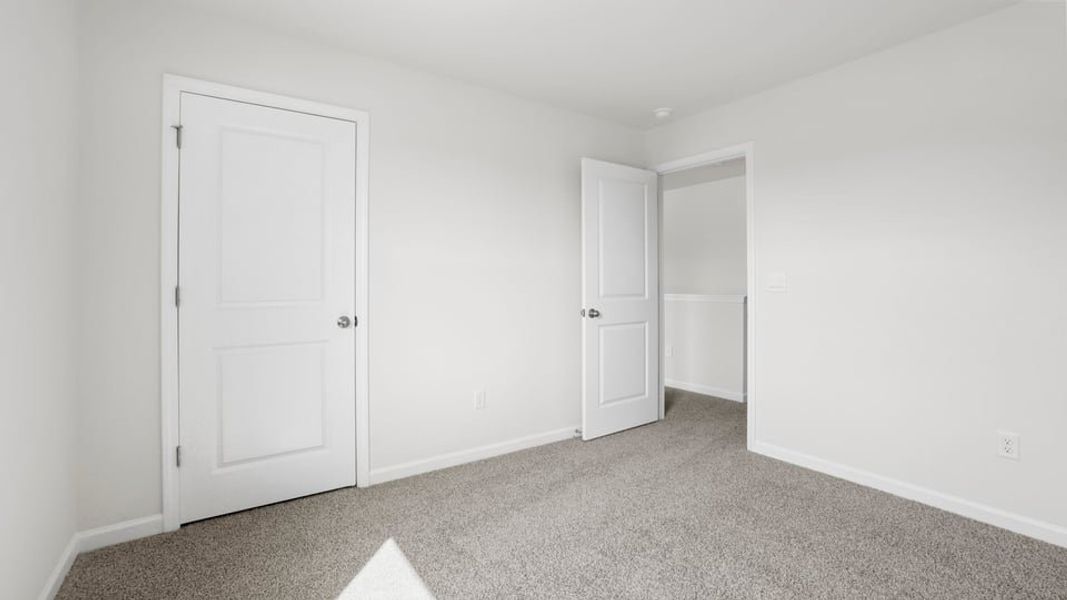 Spacious, unfurnished interior of a new home in Bentley Park, Greenwood (Image 31).