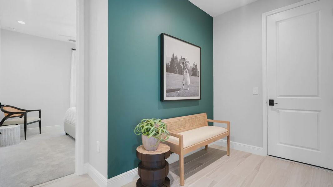 Representative furnished interior of a home built from the Meadow Brook by Neal Communities in SkySail, Naples (Image 6).