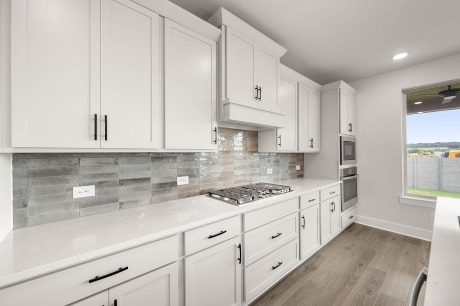 Furnished interior view inside a new home in Cottage Collection at Harvest, Argyle (Image 6).
