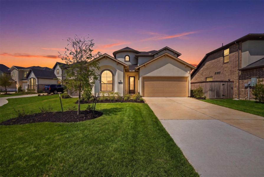 Front exterior of a new home in Bridgeland 45', 50', 70', Cypress, TX, highlighting curb appeal (Image 26). Front exterior of a new home in Bridgeland 45', 50', 70', Cypress, TX, highlighting curb appeal (Image 26).