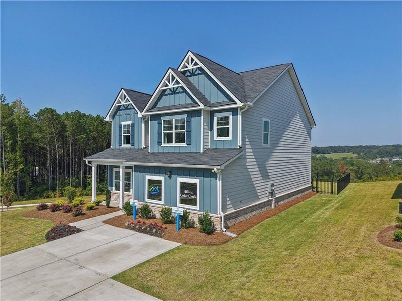 Front exterior of a new home in The Hills at Cedar Creek, Winder, GA, highlighting curb appeal (Image 25). Front exterior of a new home in The Hills at Cedar Creek, Winder, GA, highlighting curb appeal (Image 25).