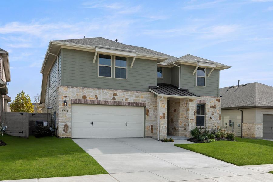 Front exterior of a new home in Discovery Collection at Painted Tree Village, McKinney, TX, highlighting curb appeal (Image 2). Front exterior of a new home in Discovery Collection at Painted Tree Village, McKinney, TX, highlighting curb appeal (Image 2).
