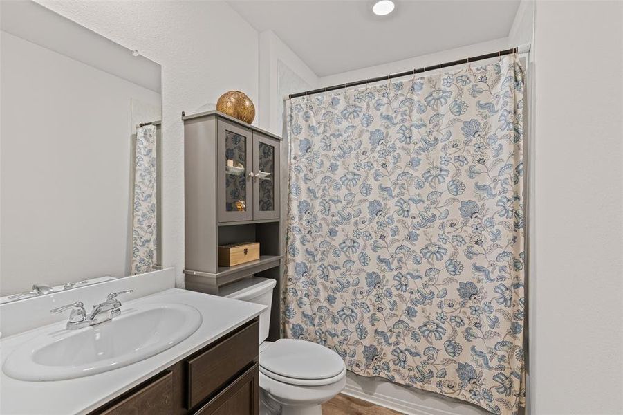 Full bathroom with modern vanity, ample storage, and shower/tub combo — perfect for family or guests. Full bathroom with modern vanity, ample storage, and shower/tub combo — perfect for family or guests.