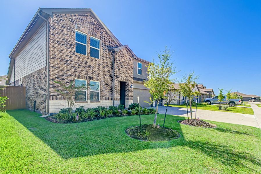 Front exterior of a new home in River Ranch Meadows, Dayton, TX, highlighting curb appeal (Image 1).