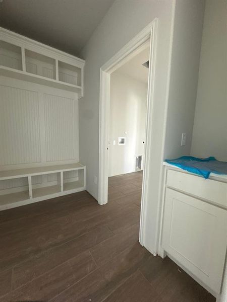 Mudroom featuring dark wood-style floors