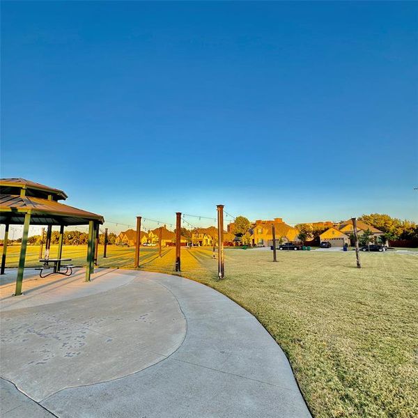 Surrounding community featuring a lawn and a gazebo