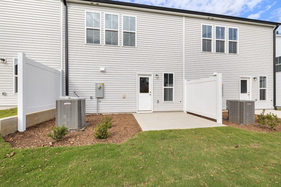 Exterior details and patio area of a home in Poets Walk, Whitsett (Image 3).