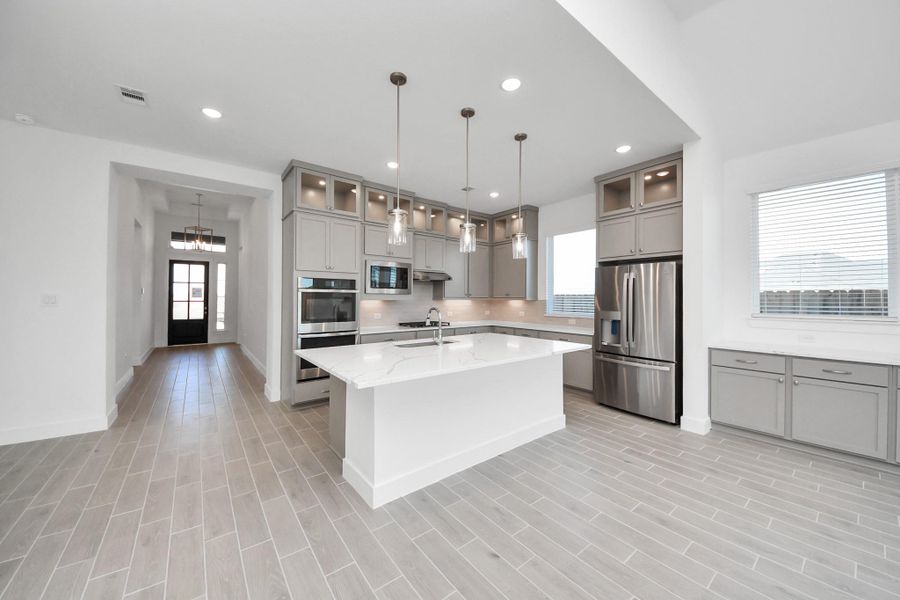 Furnished interior view inside a new home in Meridiana, Manvel (Image 7).