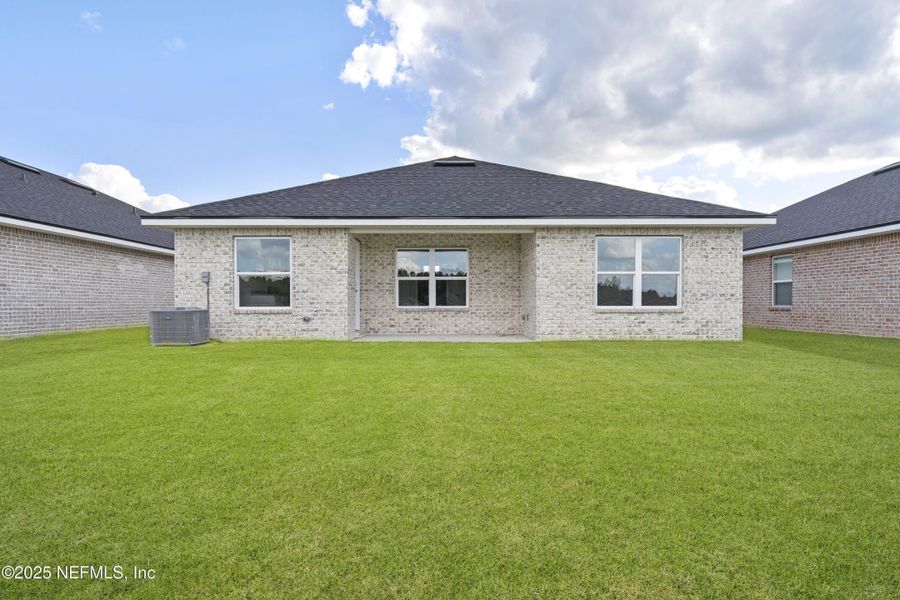 Exterior details and patio area of a home in Shadow Crest at Rolling Hills, Green Cove Springs (Image 2).