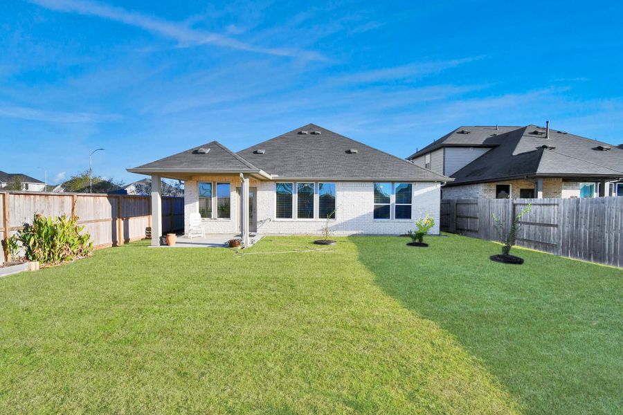 Exterior details and patio area of a home in The Timbers at Mason Woods, Cypress (Image 3).