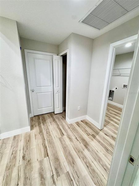 Coat closet near laundry room