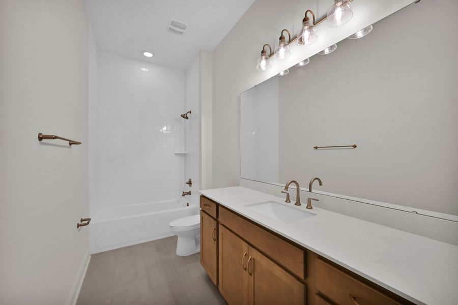Representative furnished interior of a home built from the Hudson II by Riverside Homes in Hidden Creek at SilverLeaf 70' Series, St. Augustine (Image 8).