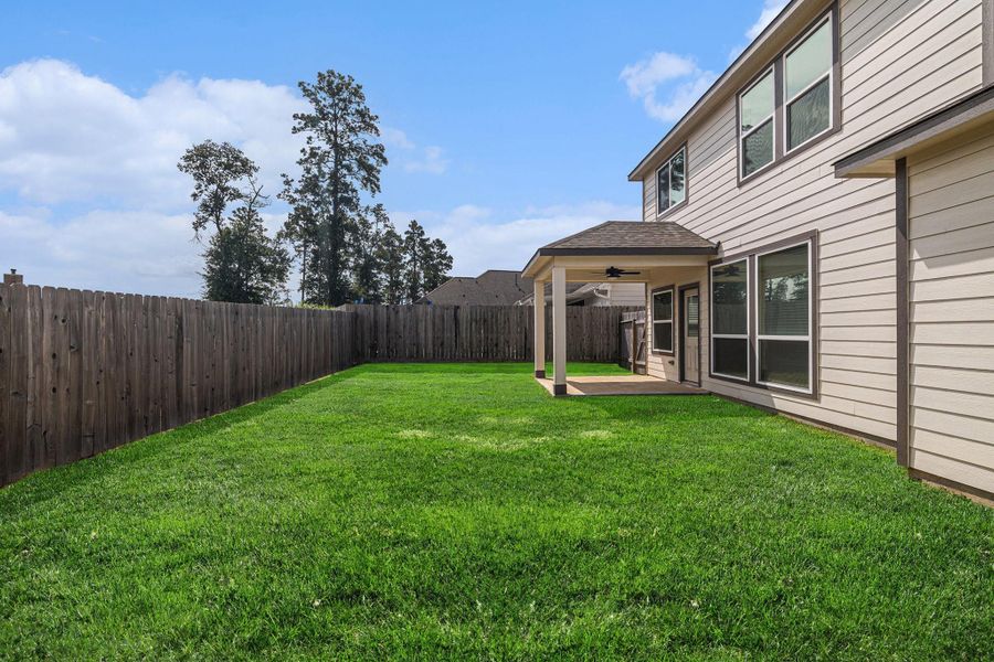 Front exterior of a new home in Grand Oaks Reserve, Cleveland, TX, highlighting curb appeal (Image 2).