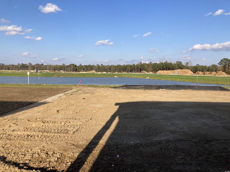 View of yard with a water view
