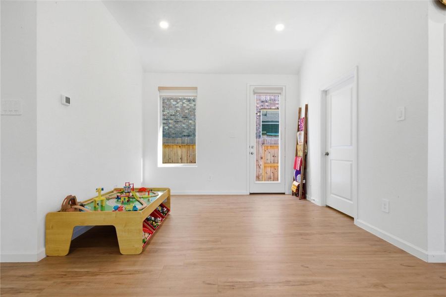 A closer look at this separate dining room area, which door leads to the side of the backyard