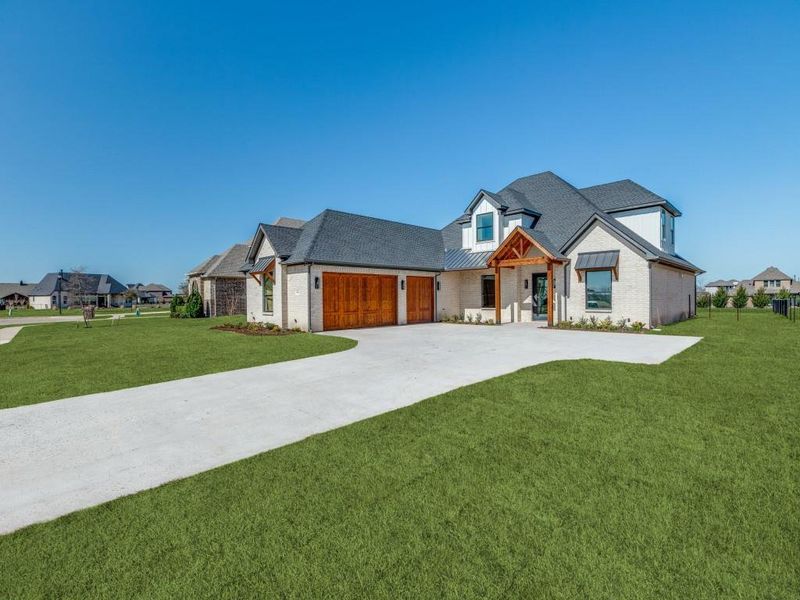 Front exterior of a new home in , Gunter, TX, highlighting curb appeal (Image 25).