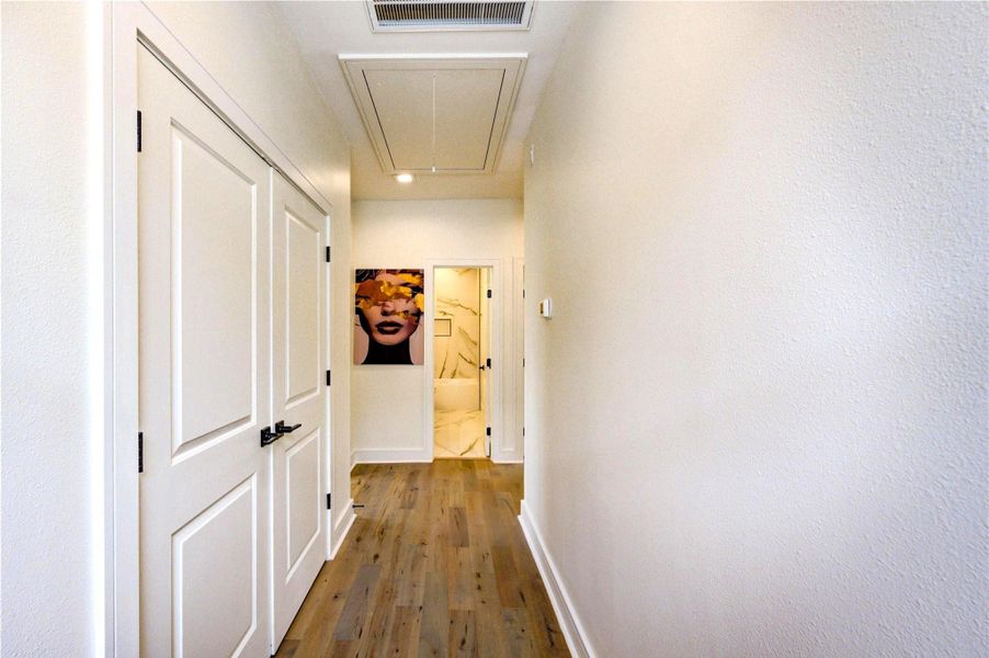 Upstairs hallway with convenient laundry area, featuring clean modern finishes and easy access to bedrooms.