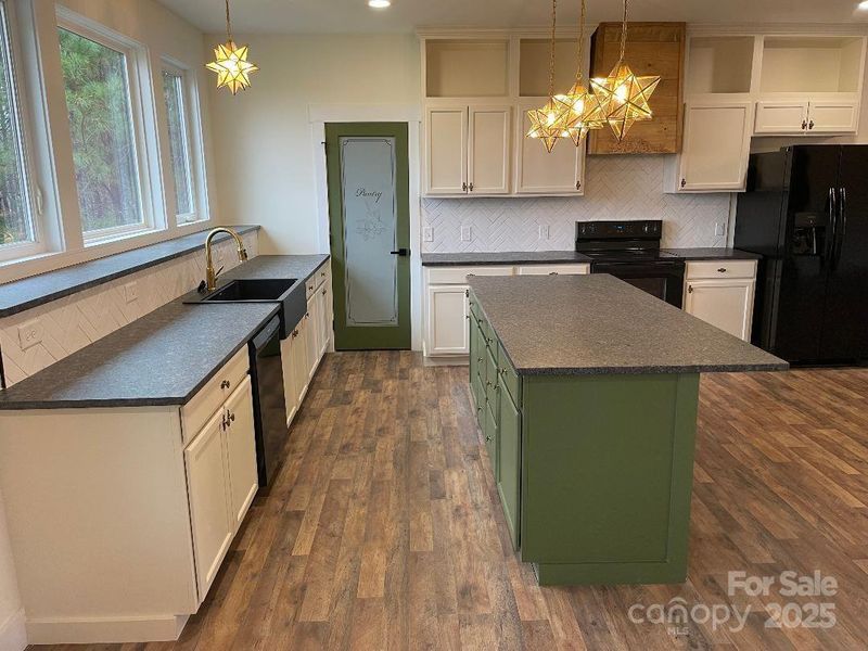 Kitchen prep space and backyard view