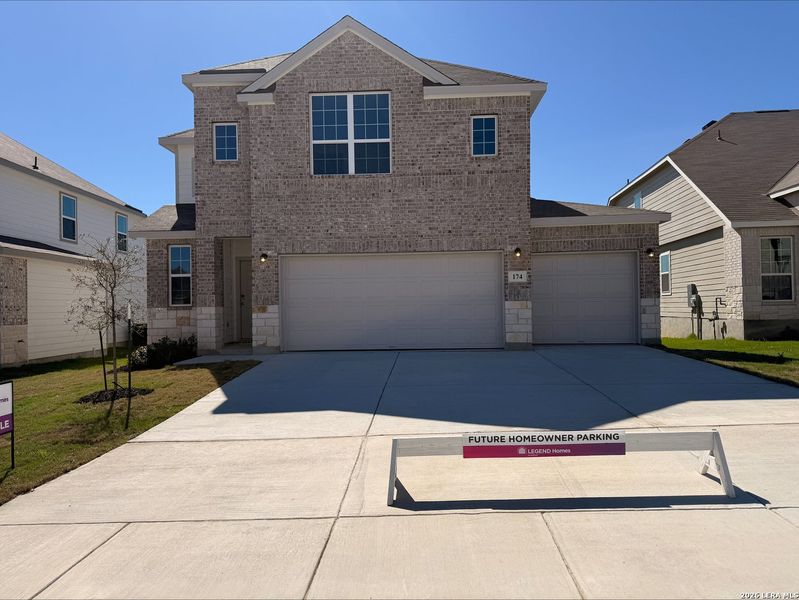 Front exterior of a new home in Hunters Ranch, San Antonio, TX, highlighting curb appeal (Image 1). Front exterior of a new home in Hunters Ranch, San Antonio, TX, highlighting curb appeal (Image 1).