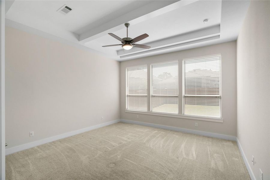 Primary spacious bedroom with ensuite bathroom.