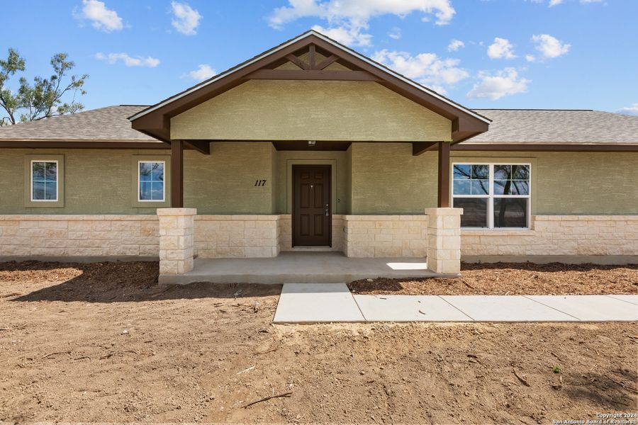 Front exterior of a new home in , Pleasanton, TX, highlighting curb appeal (Image 30). Front exterior of a new home in , Pleasanton, TX, highlighting curb appeal (Image 30).