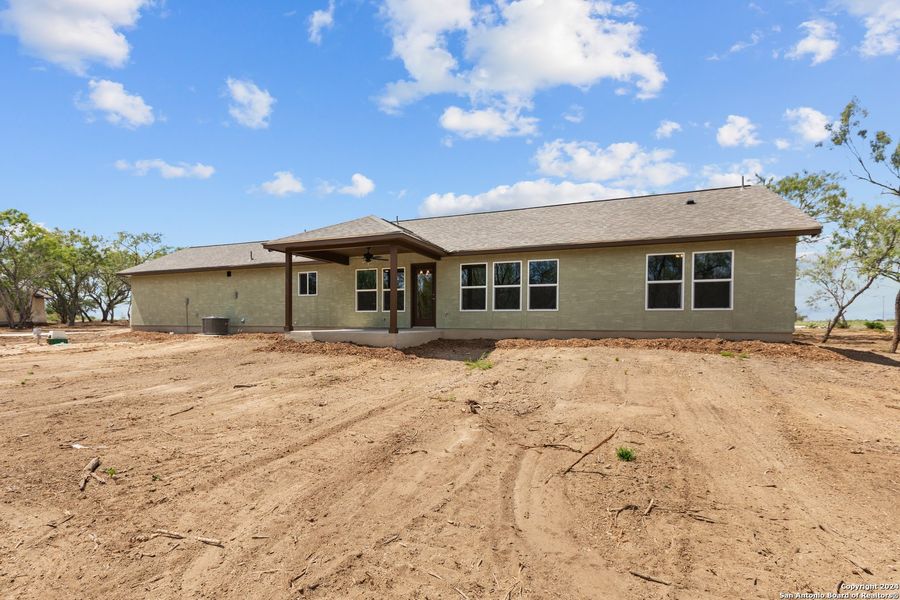Front exterior of a new home in , Pleasanton, TX, highlighting curb appeal (Image 29). Front exterior of a new home in , Pleasanton, TX, highlighting curb appeal (Image 29).