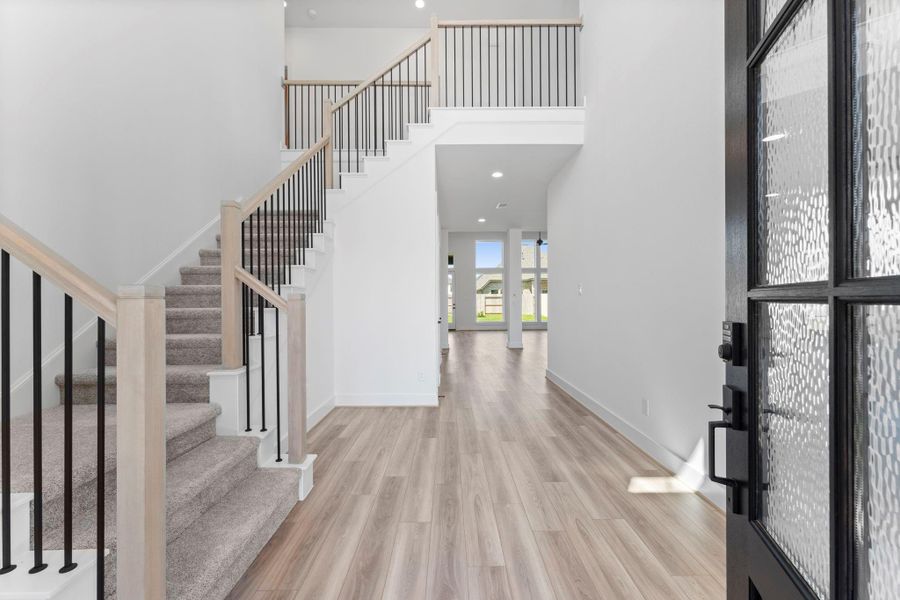 Elegant luxury vinyl plank flooring enhances the downstairs living areas. Elegant luxury vinyl plank flooring enhances the downstairs living areas.