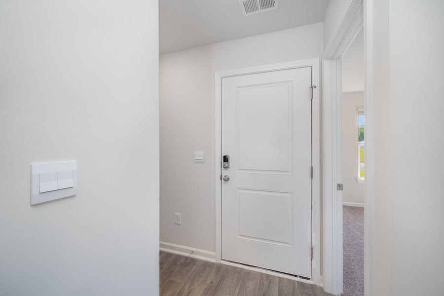 Representative unfurnished interior of a home built from the HANNAH by D.R. Horton in The Meadows at Wildwood Village, Shallotte (Image 5).