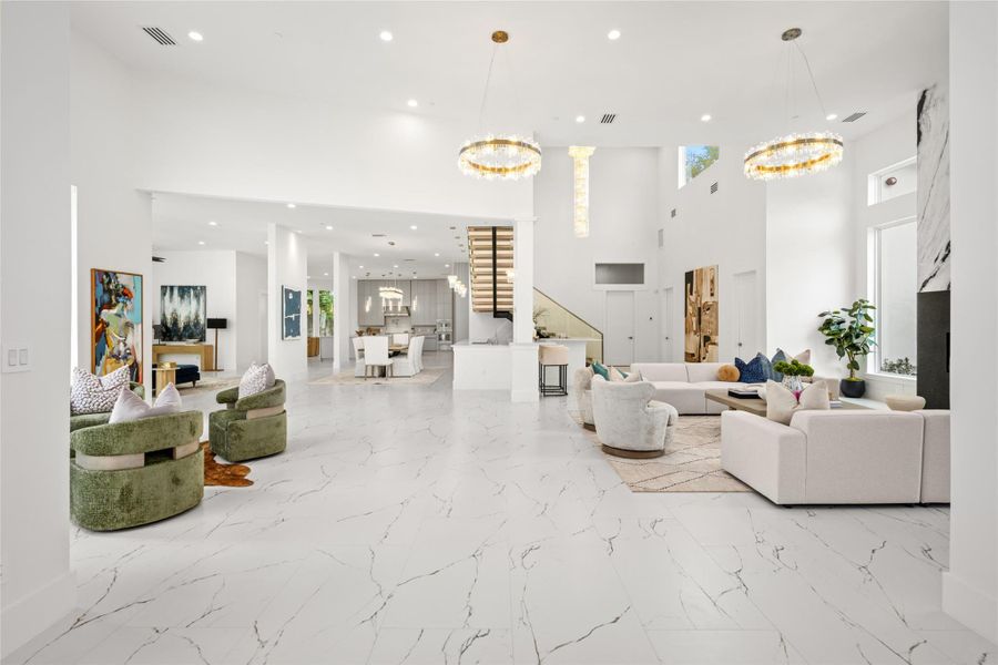 As you proceed through the entry, you're welcomed with multiple sitting areas, tall ceilings and incredible natural light. As you proceed through the entry, you're welcomed with multiple sitting areas, tall ceilings and incredible natural light.