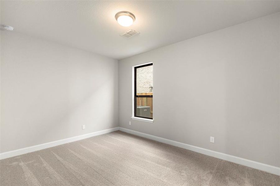 Spacious Bedroom Downstairs with Natural Lighting and a View