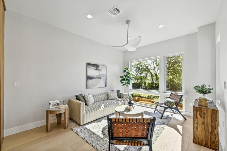 2nd Floor Open Living area with plenty of space for seating. (This is Unit #2 - each Unit has the same layout, however a few differing details such as light fixtures, custom cabinet/backsplash/tile colors)