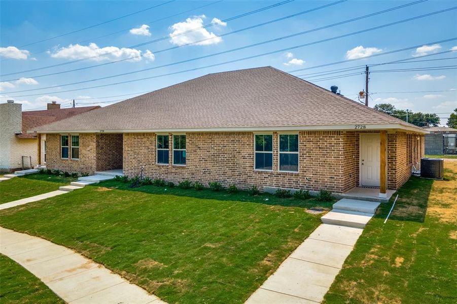 Ranch-style home featuring cooling unit and a front lawn