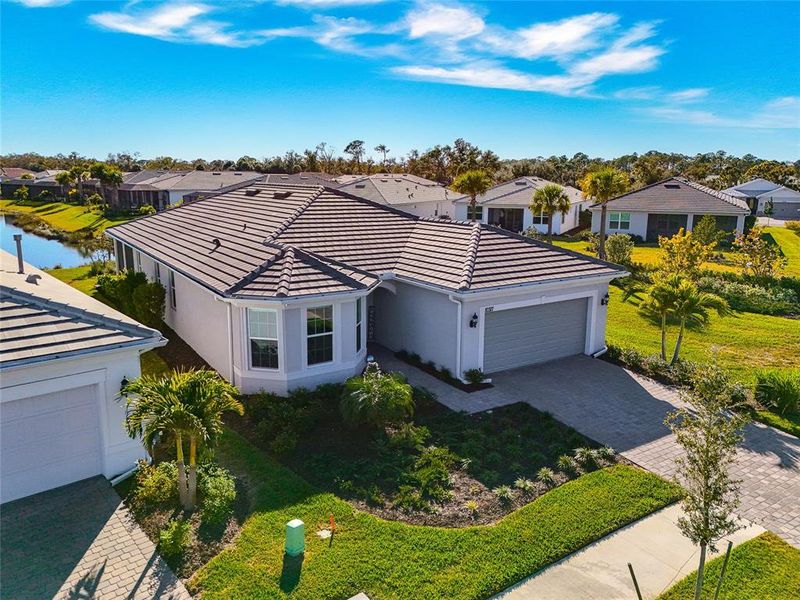 Front exterior of a new home in , Englewood, FL, highlighting curb appeal (Image 23). Front exterior of a new home in , Englewood, FL, highlighting curb appeal (Image 23).